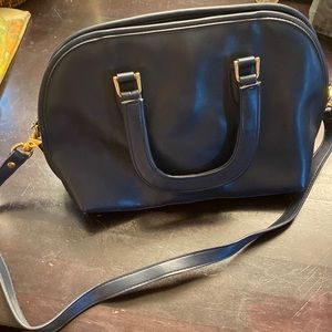 Vintage Coach bag navy blue leather exterior, suede interior.